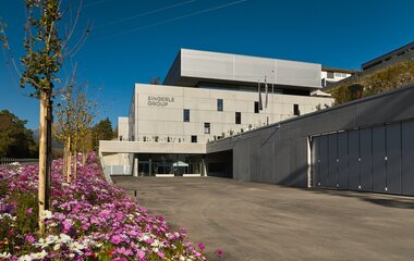 Zingerle Group headquarters in Sciaves, South Tyrol, surrounded by forest and mountains.
